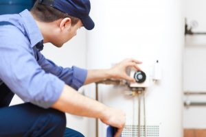 Plumber Repairing Water Heater